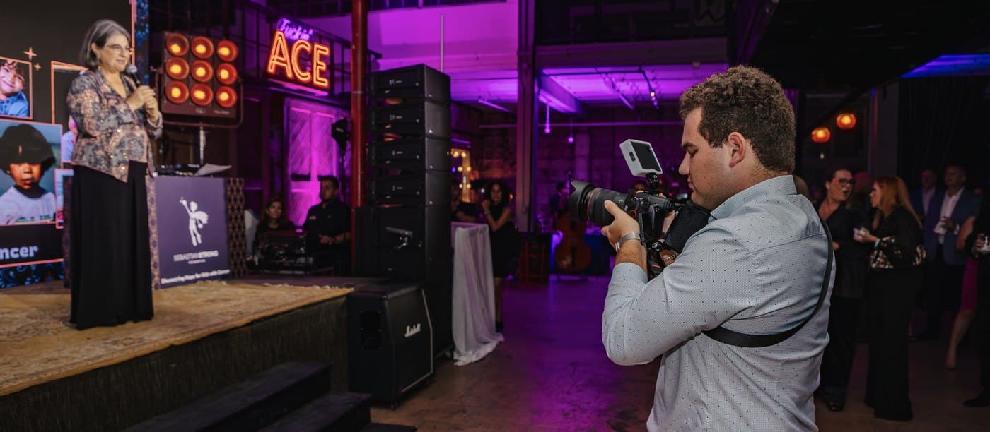 Filming a speaker on stage at a SebastianStrong Foundation event